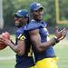 Michigan junior quarterback Denard Robinson and sophomore quarterback Devin Gardner goof around as they pose for photographs during media day at the Al Glick Field House on Sunday.  Melanie Maxwell | AnnArbor.com